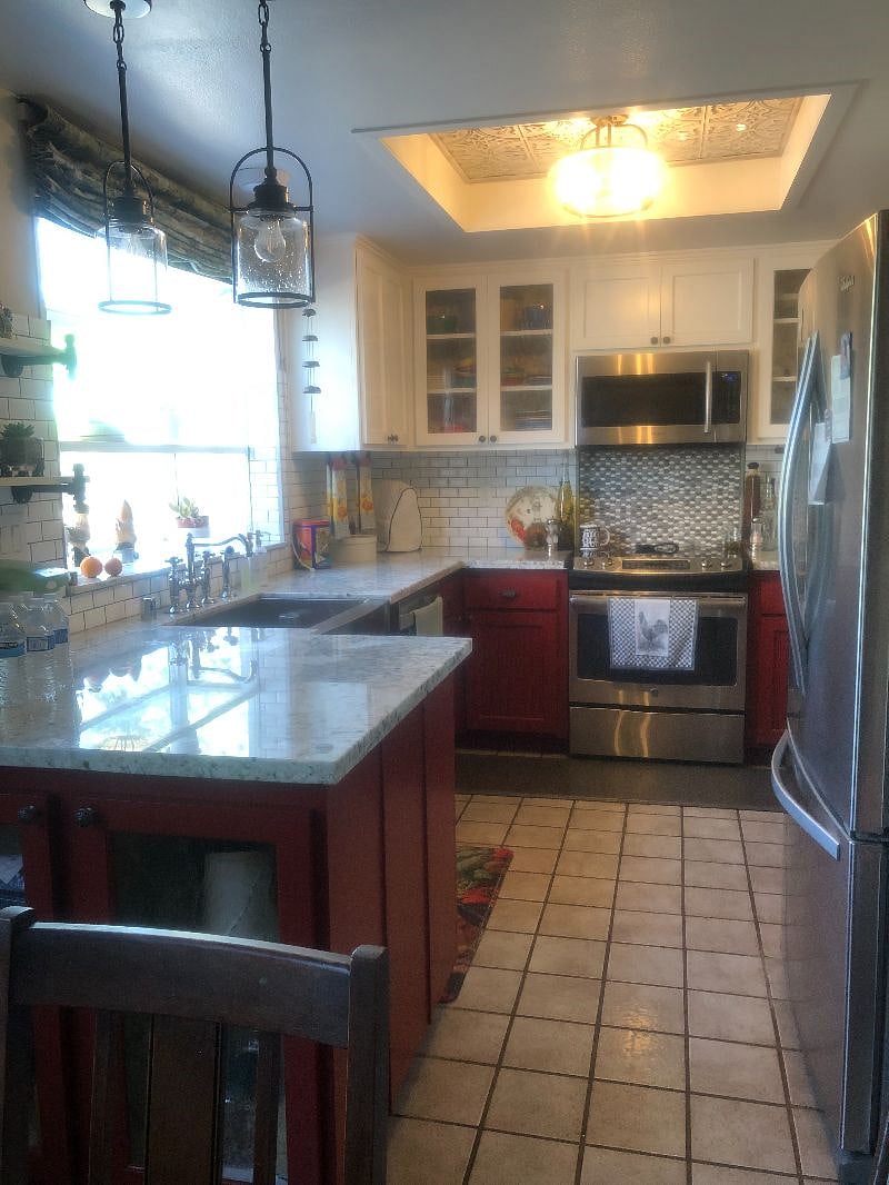 Kitchen with microwave, refrigerator, electric range, disposal and dishwasher
