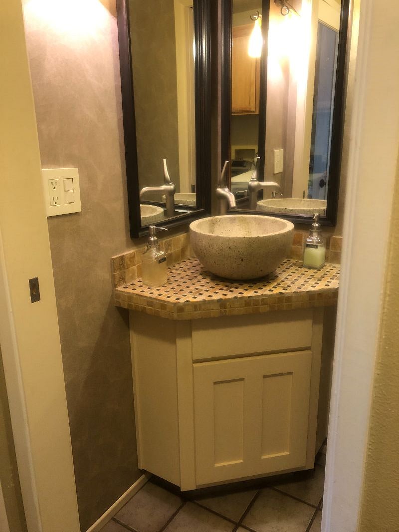 1/2 bath on first floor is just off family room and is across from laundry room