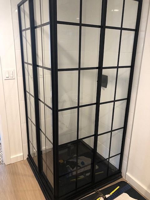 New construction shower with sliding doors.
