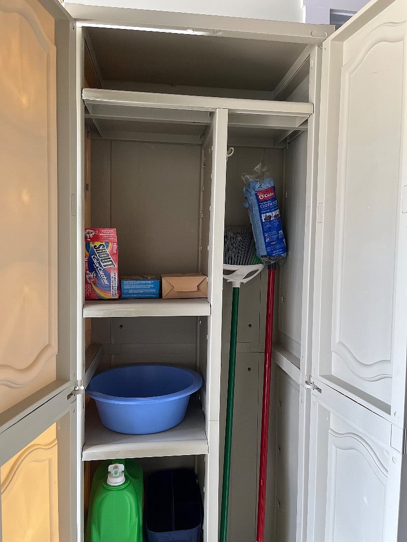 Cleaning cabinets with detergents and brooms. There is also a vacuum/mopper piece of appliance available.