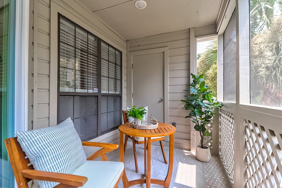 Screened-in-porch with a setting for two - perfect for coffee in the morning!