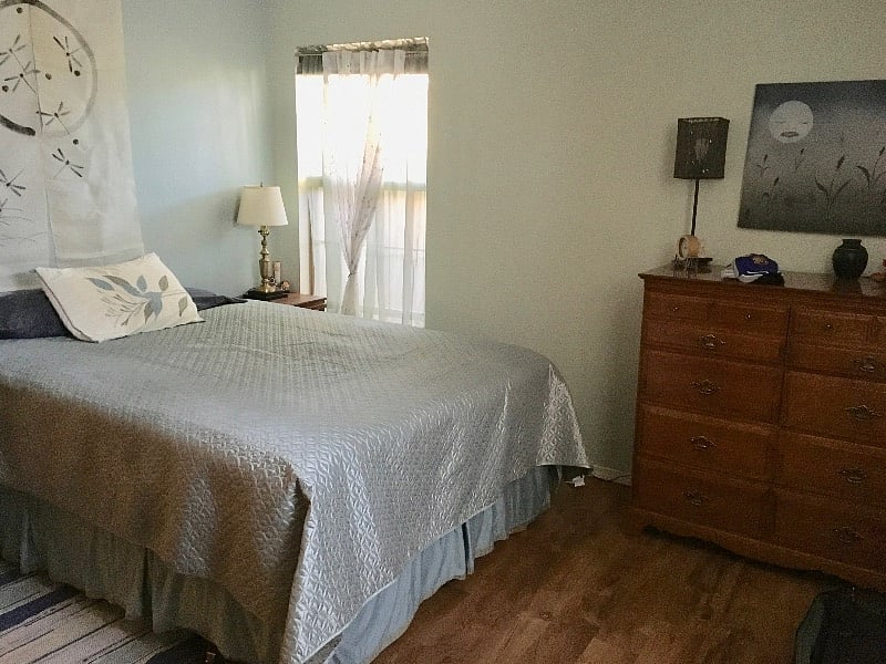 Full size bed in master bedroom.