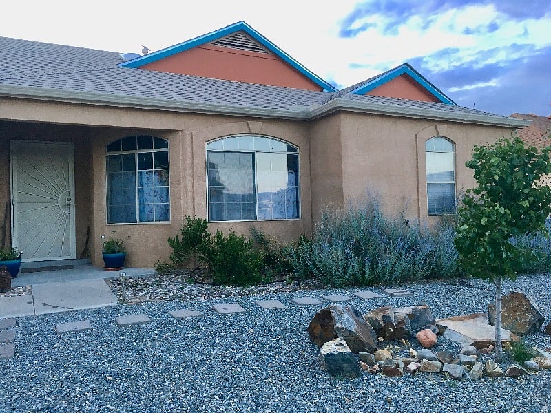 Front windows face east toward the Sandia Mountains.
