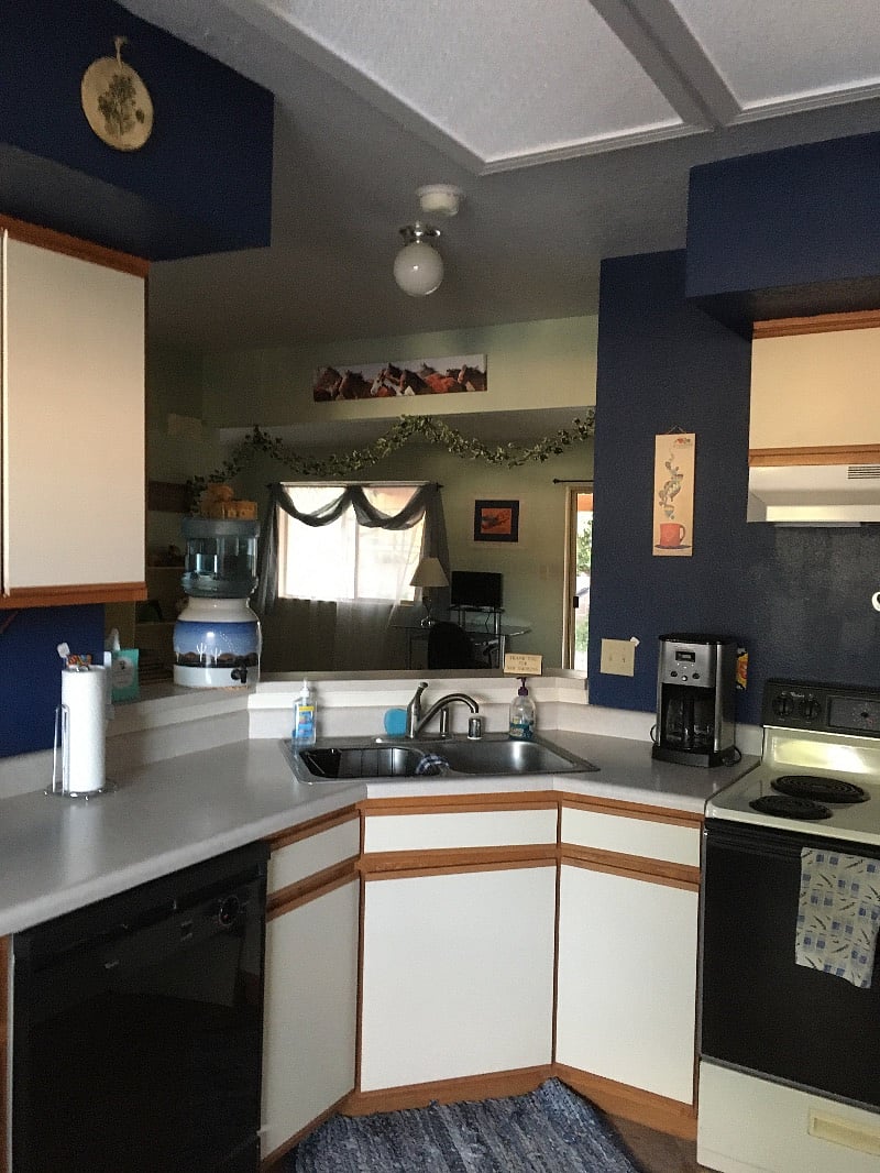 Large kitchen with appliances and fully stocked with dishes, utensils and cooking supplies.