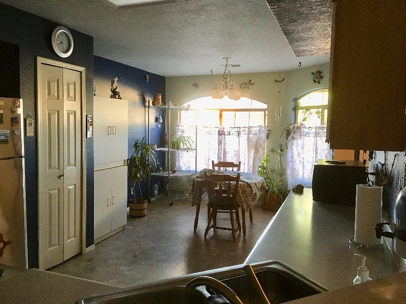 View of dining area, attached to kitchen. East facing windows provide great light and mountain views.