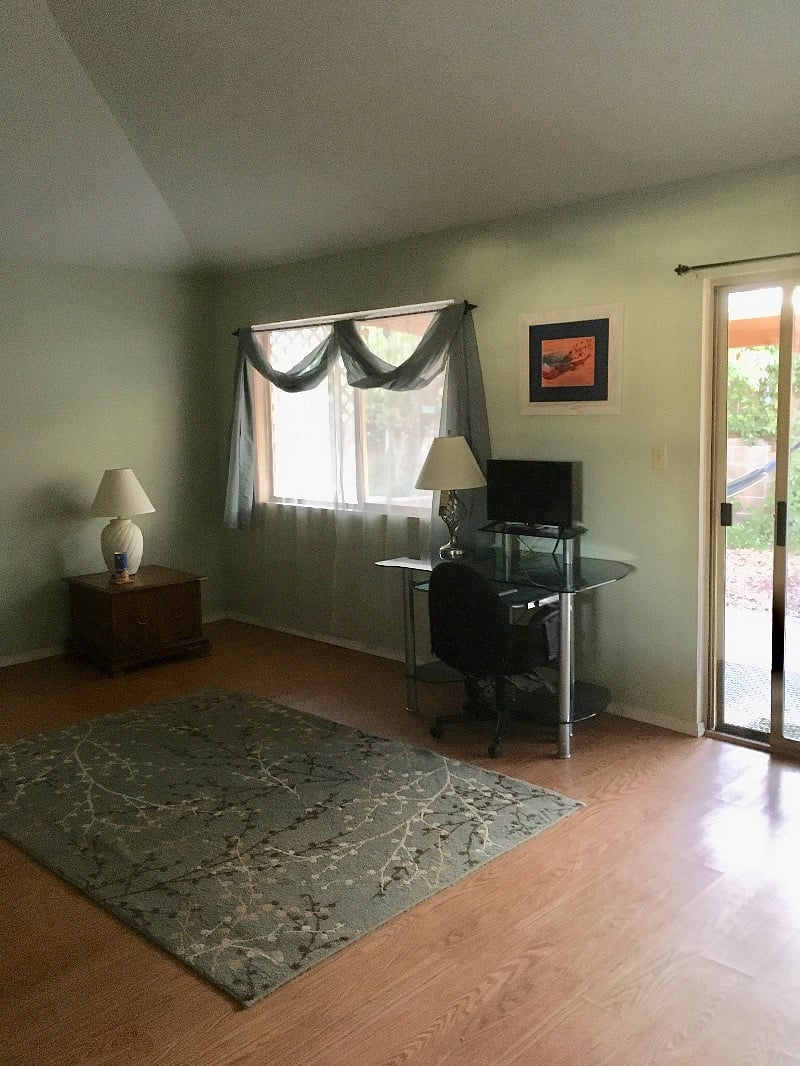 Living room with desk and (larger) TV.