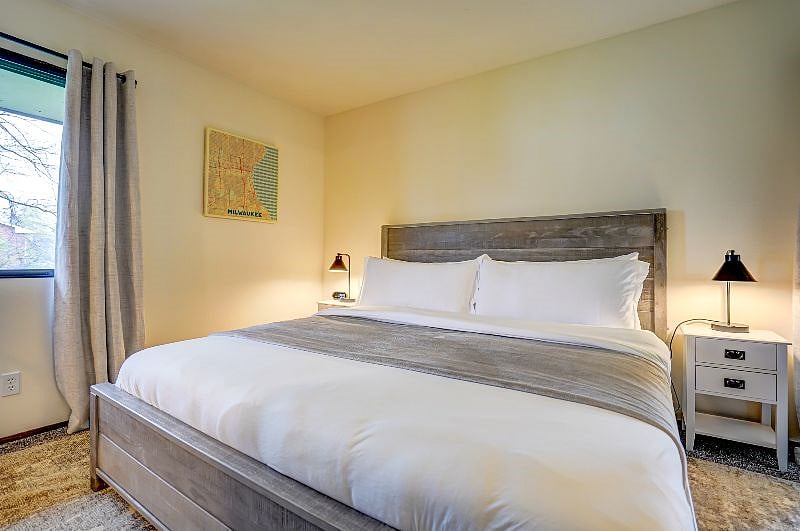 Relax in a spacious bedroom furnished with a King size bed.