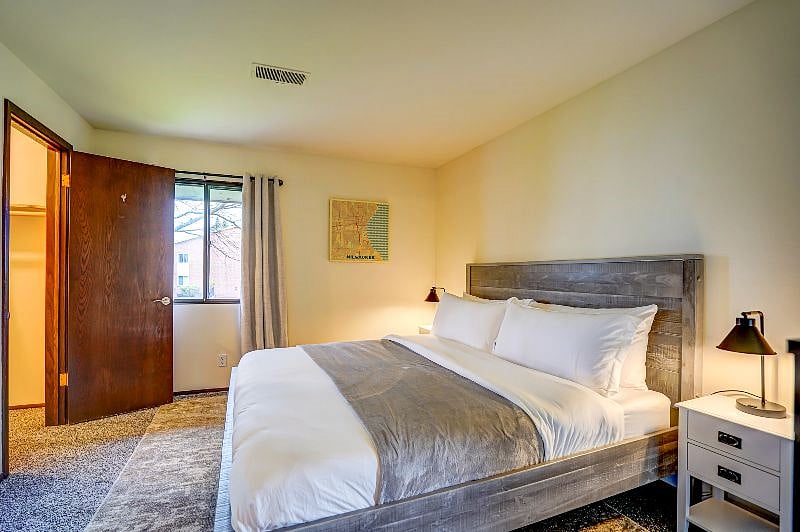 Relax and rejuvenate on a spacious king size bed in a cozy bedroom