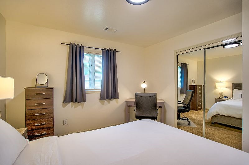 Indulge in the utmost comfort in our stylish master bedroom