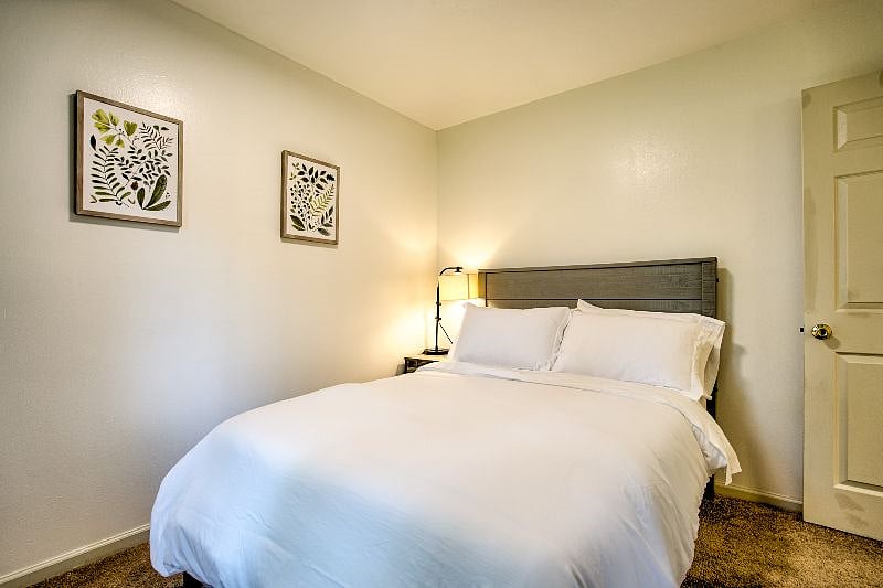Cozy comfort awaits in our charming second bedroom, furnished with a comfortable full-size bed for a restful night's sleep.