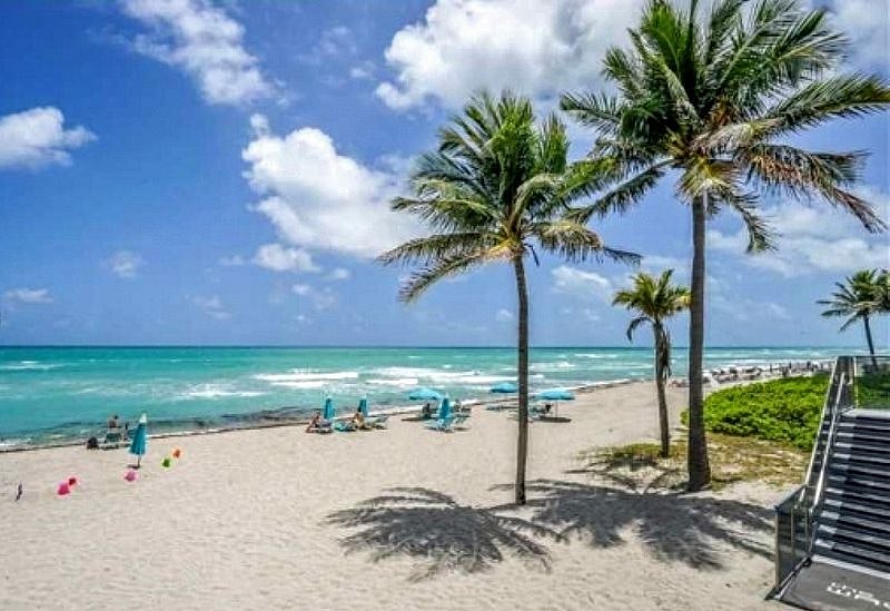 Beach in Front of Building with access to beach & complimentary seats & umbrellas