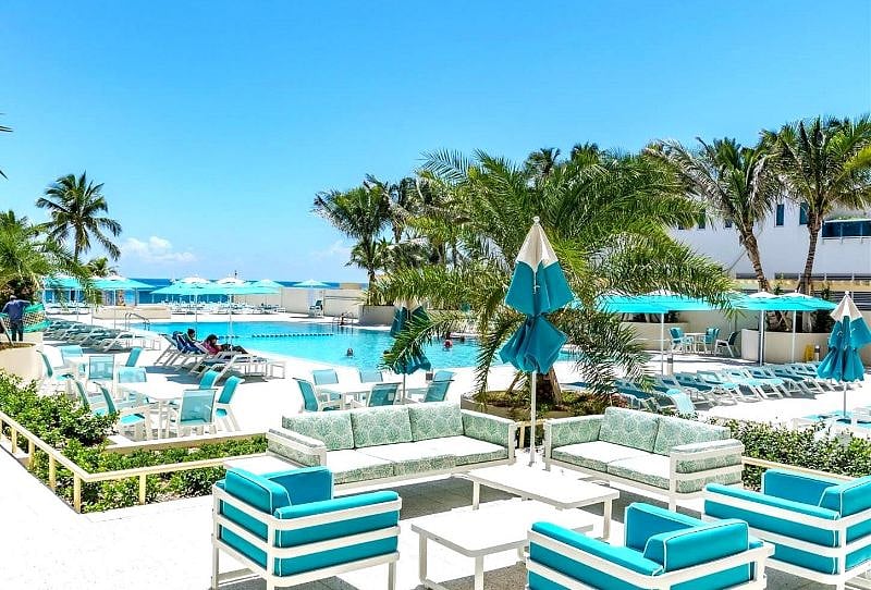 Pool Deck w Lounges & Tables Overlooking the Pool & Ocean.
It is Like a Spacious Park next to the Beach.