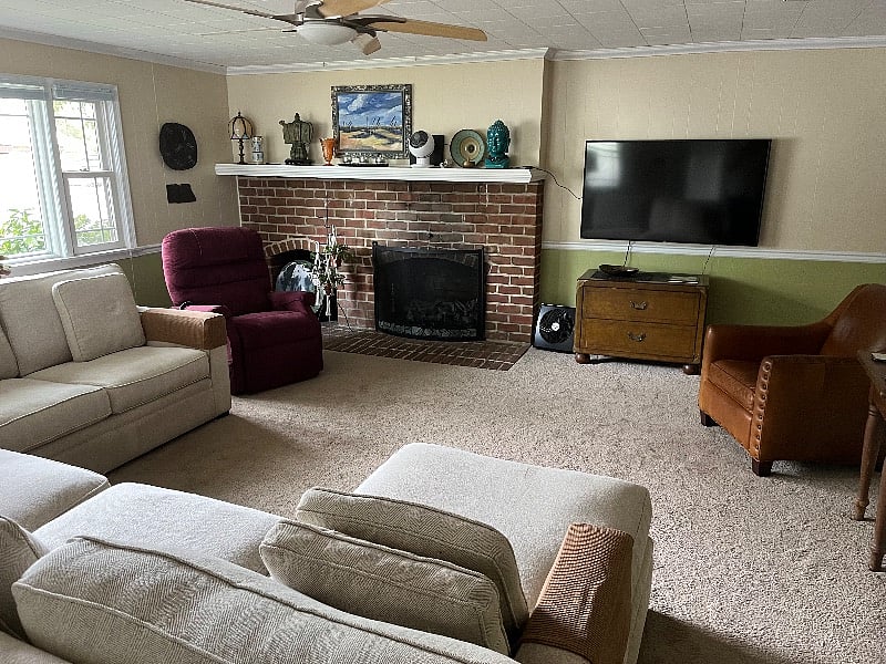 Den with large sectional couch, perfect for tv watching.