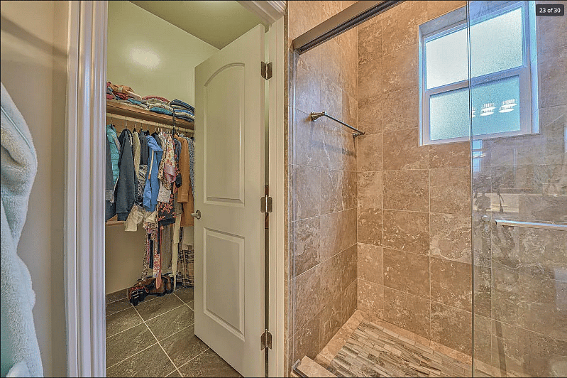 Bedroom 2's private bath and walk-in closet
