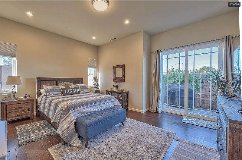 Master bedroom with doors to back patio, Queen bed will be replaced with King bed.