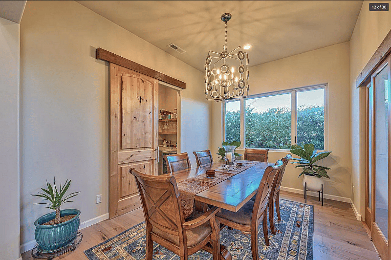 Dining room Den is open and can be set up as a dining room, family room, yoga room, etc. Let us know what you prefer. Dining room furniture has changed since this photo,