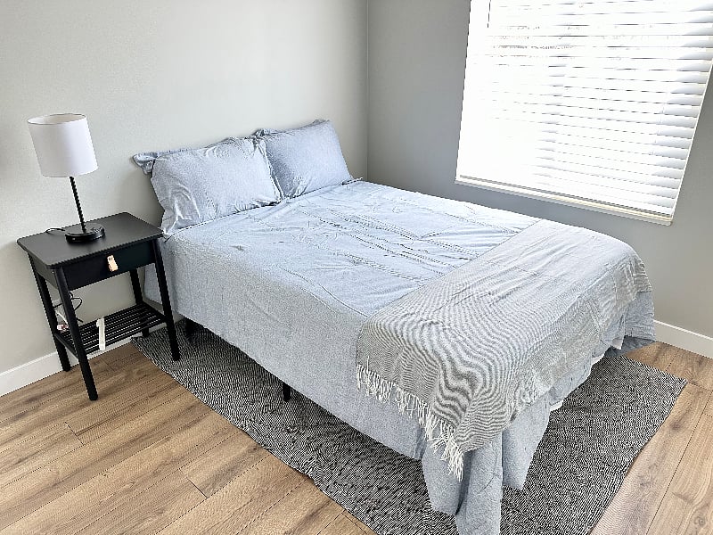 upstairs bedroom - full size bed, nightstand, and closet