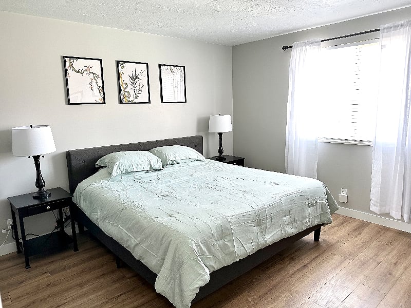 upstairs master bedroom - king size bed, dresser and double closet
