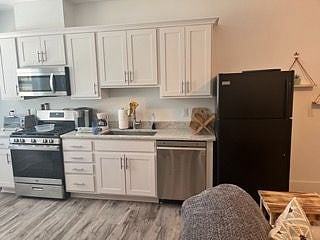 Full Kitchen-dishwasher, stove/oven, microwave, full refrigerator and freezer, plenty of cabinets for storage