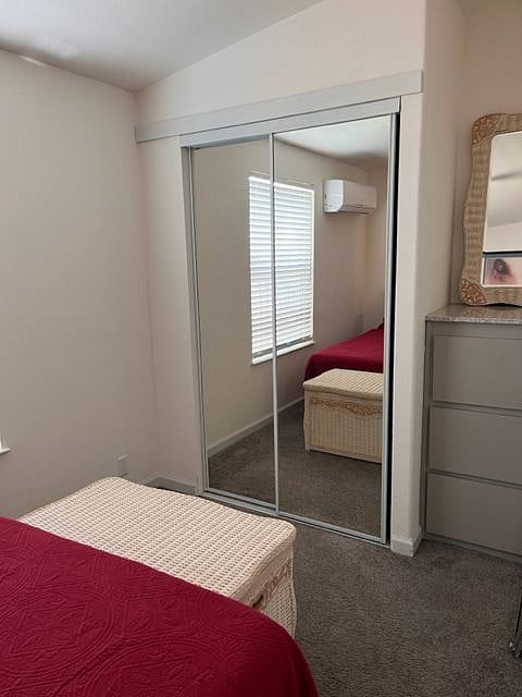 View of bedroom closet and dresser