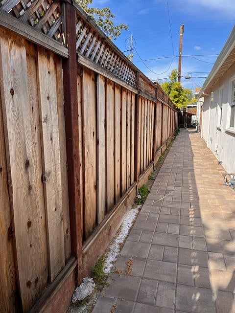 Private walkway to unit in the back of main house on property