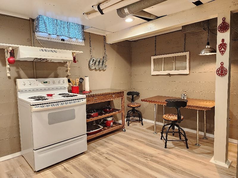 Oven, workspace, and eating area.