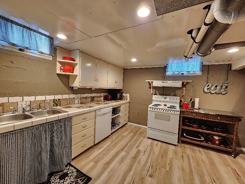 Kitchen with dishwasher, toaster, microwave.
