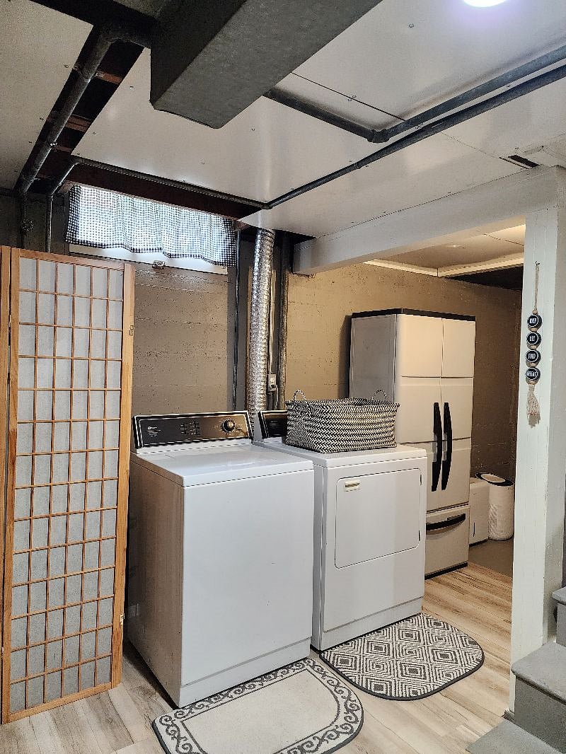 Full size washer/dryer, storage, cleaning supplies.