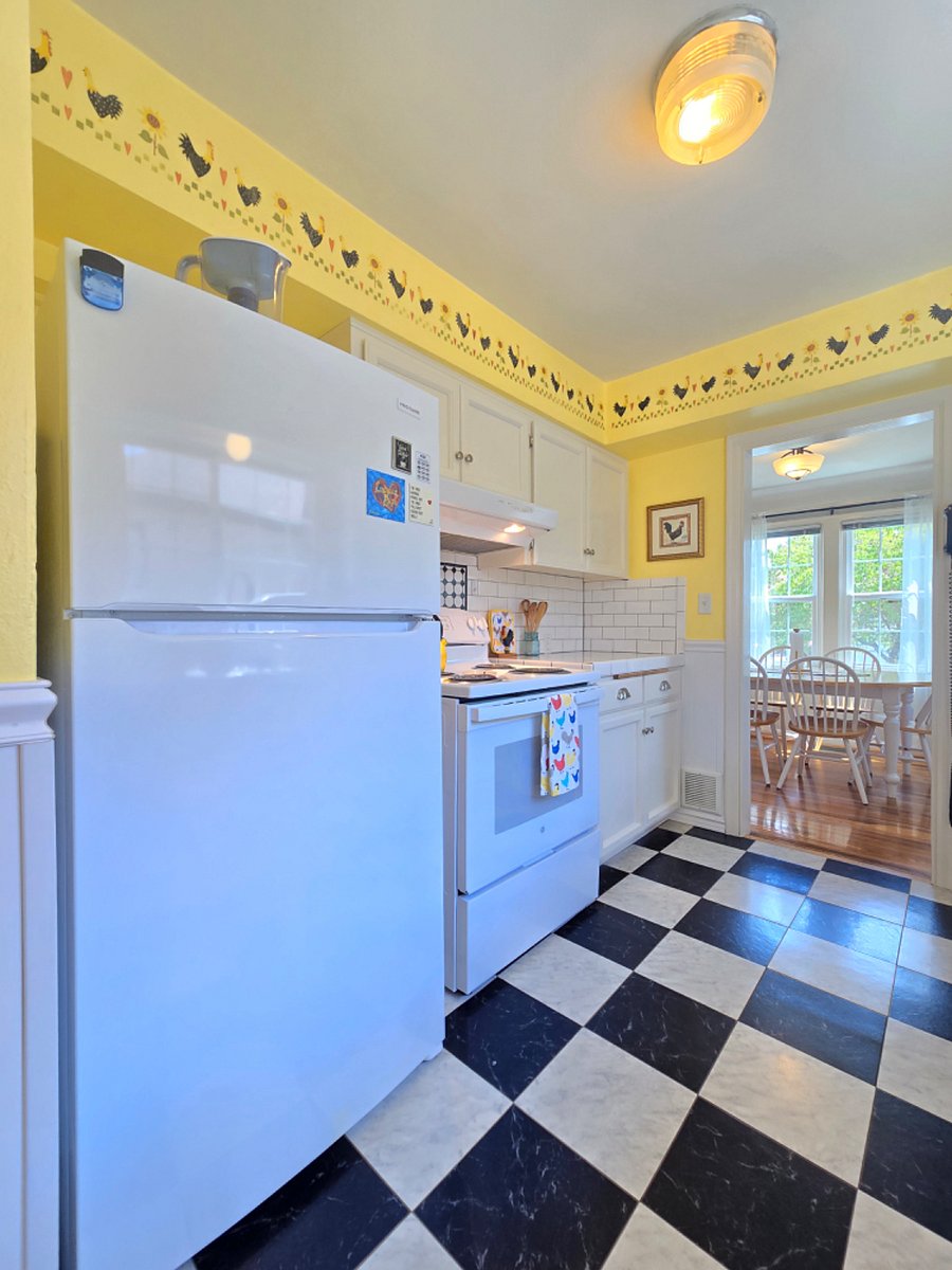 Full size refrigerator with ice maker.