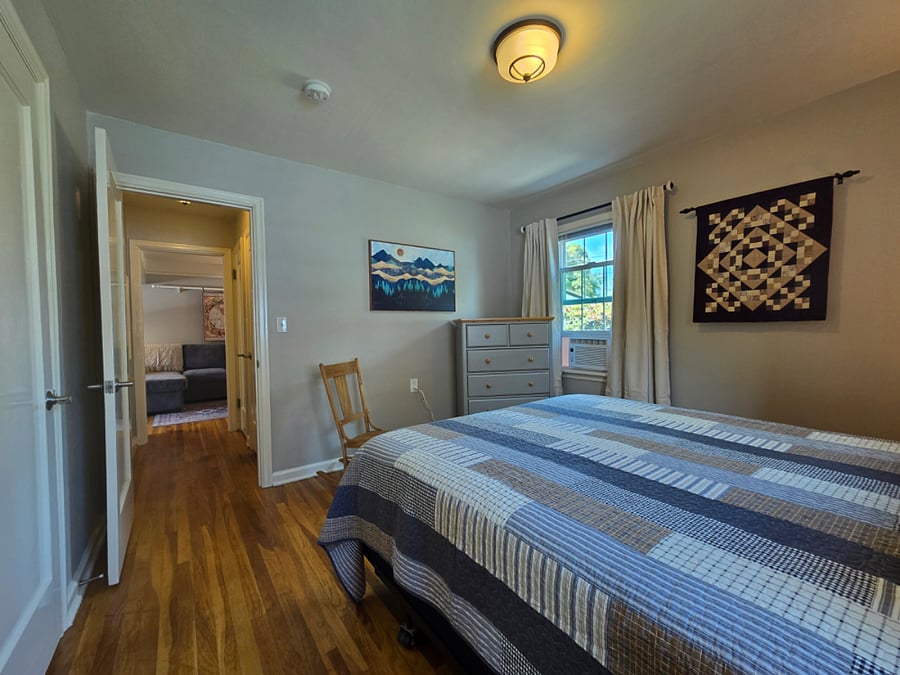 Chest of drawers, bathroom is straight out the door and to the right.