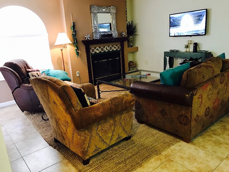 Comfy chenille and leather sofa and chairs.