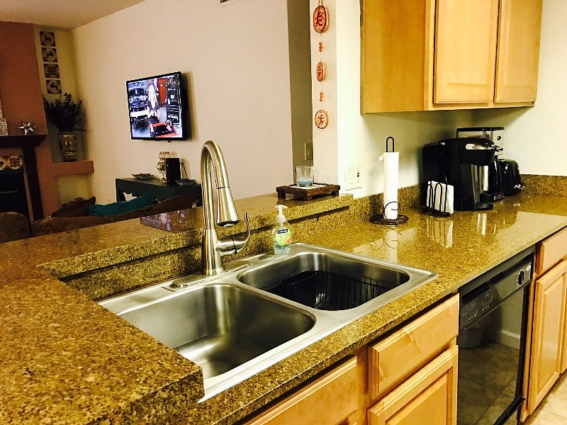 Fully stocked kitchen with Keurig coffee maker.