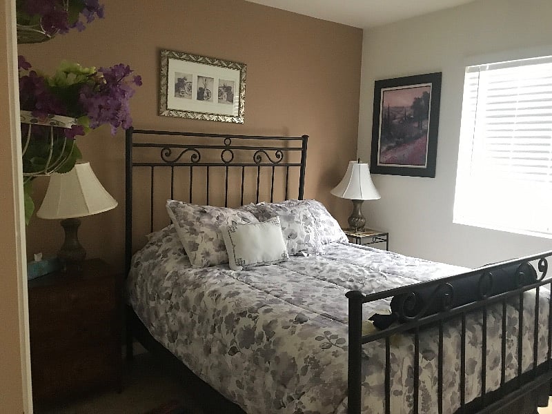 The guest room has an iron full size bed.