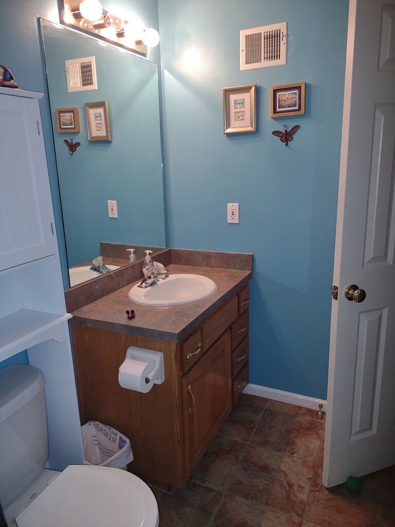 Bathroom is semi-private, sink closest to laundry room & only toilet on this level. 