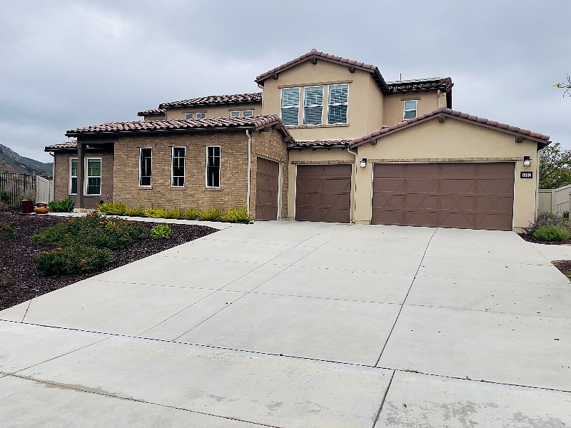 You will park in front of the garage door on the left.