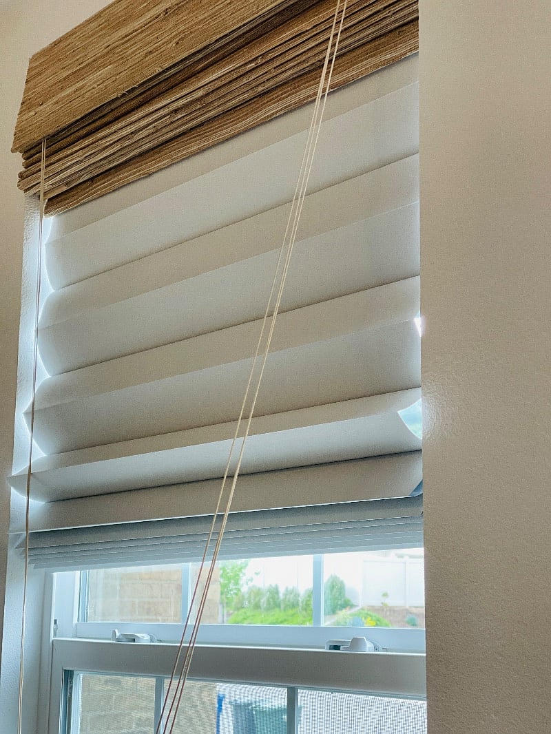 Second layer of shades to blackout the light so you can sleep well.