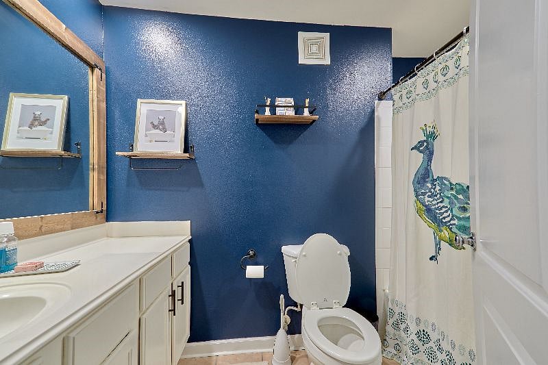 This is a full-sized stand-up shower AND bath tub with a shelf to put your toiletries! Also the shower pressure is 10/10.