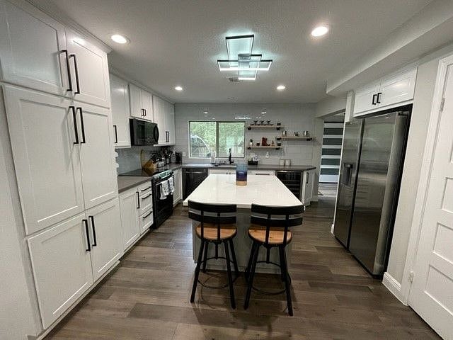 Kitchen with quartz counters, Samsung appliances, Keurig, and all cooking supplies needed.