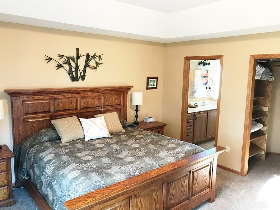 Primary Bedroom with bathroom and walk in closet as well as access to the deck.