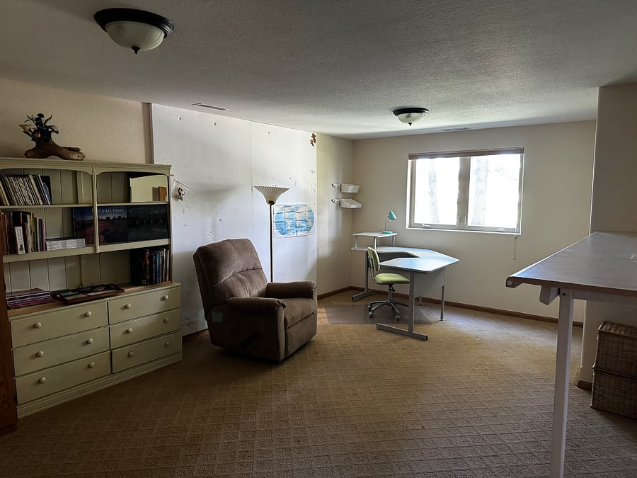 Bonus Room Downstairs, features french doors that open to the family room. 
