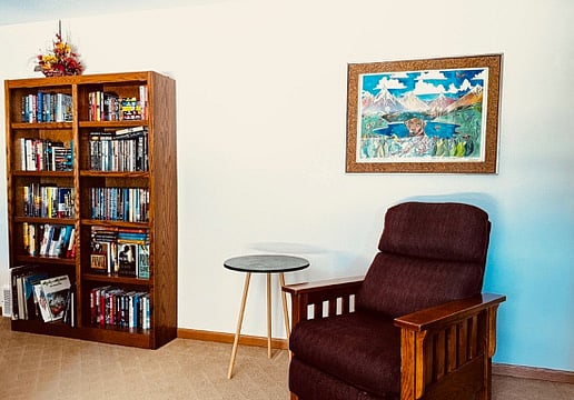 Reading nook in room with the futon