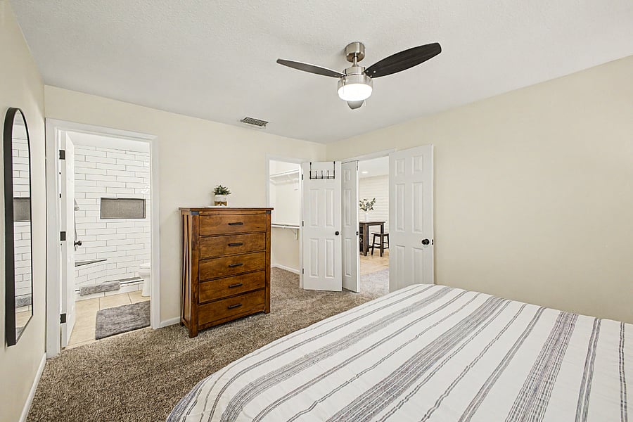 Bedroom 1 with king size bed, a walk-in closet and en suite bathroom