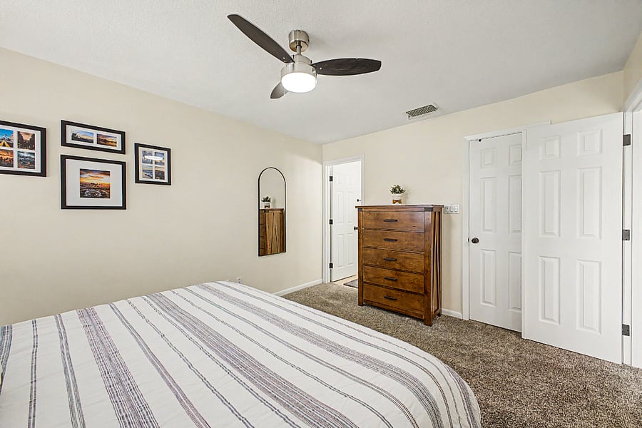 Bedroom 1 with king size bed, a walk-in closet and en suite bathroom