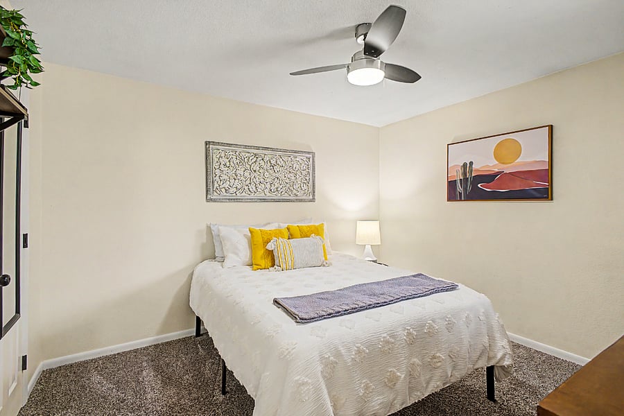 Bedroom 2 with queen size bed, a walk-in closet and en suite bathroom