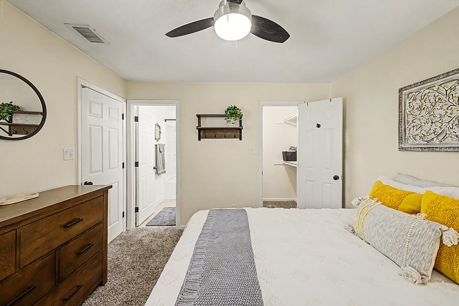 Bedroom 2 with queen size bed, a walk-in closet and en suite bathroom