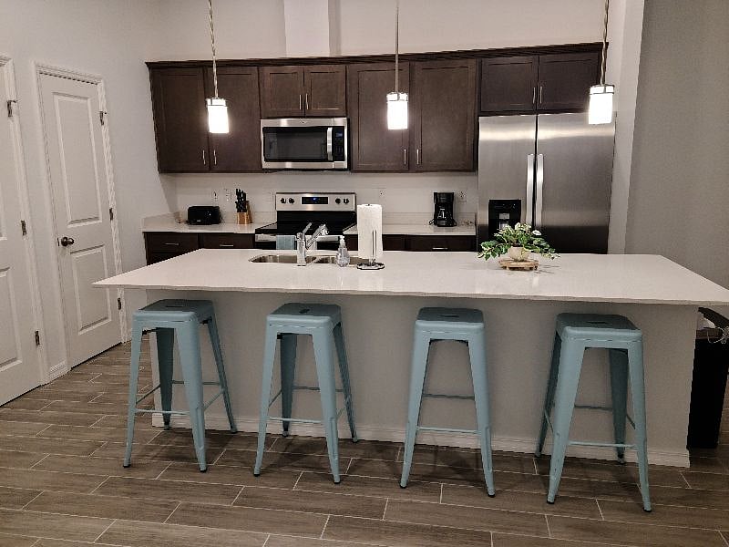 Bright kitchen with plenty of seating at island.