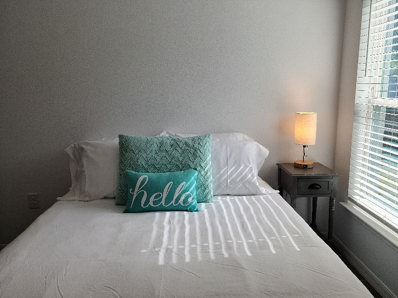 Middle bedroom gets beautiful light. Lamp has USB chargers built in.