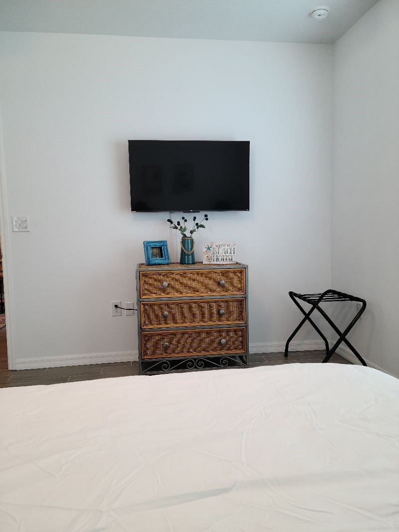 Dresser and TV in primary bedroom