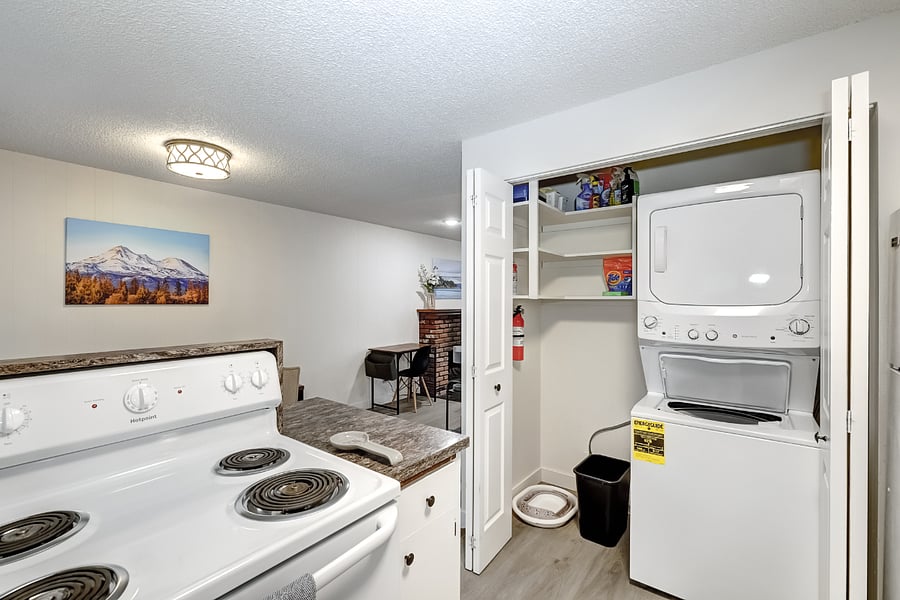 Stackable washer and dryer in closet in the kitchenN