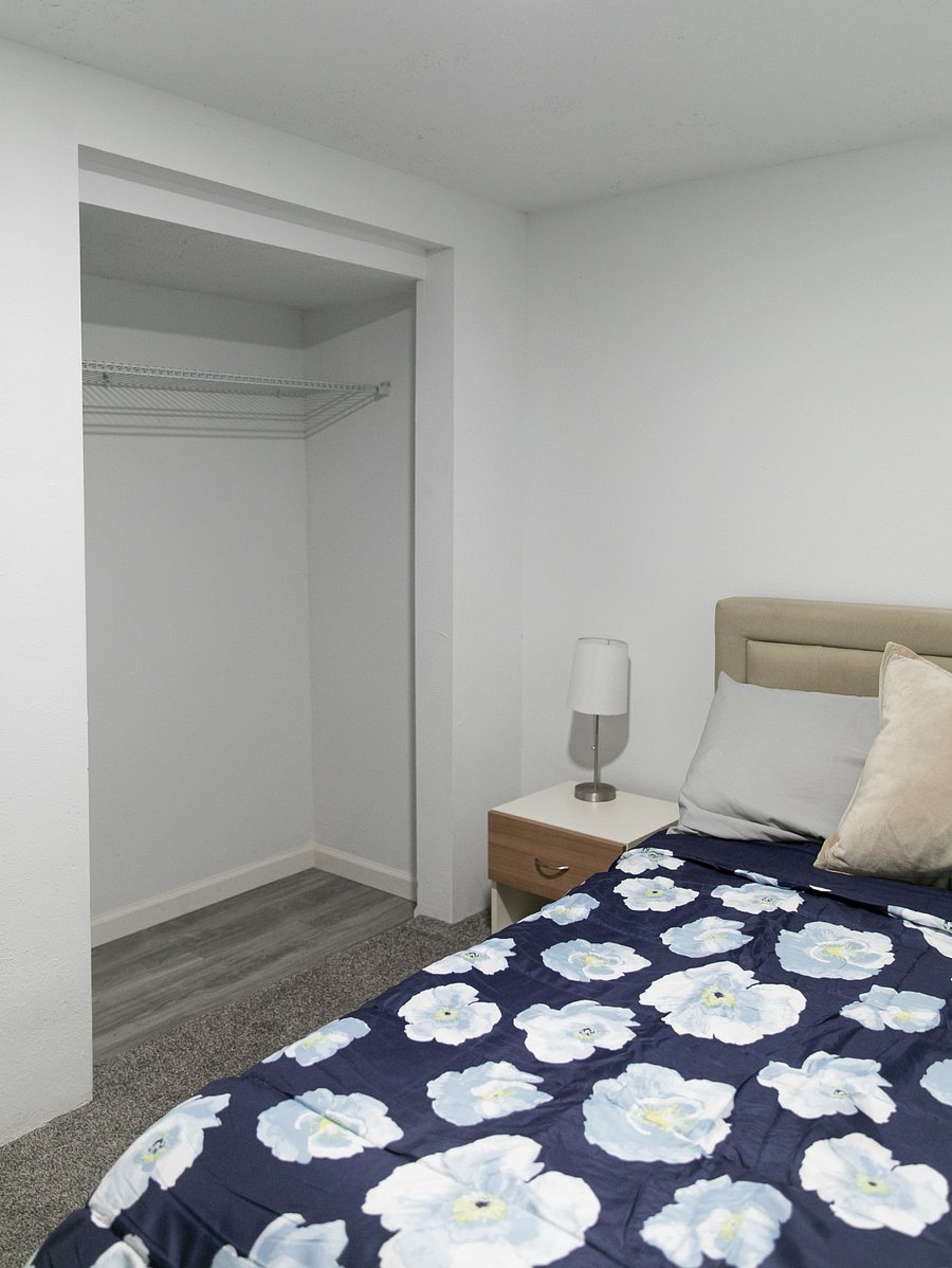 Downstairs bedroom with a full sized bed
